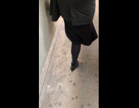 Woman walks out of subway train with sauce packet stuck to heel