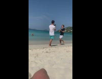 Guy beach sand ukelele sing sunglasses