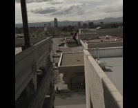 Red shirt guy parkour rooftop jump 