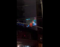 Man plays game projected screen on wall