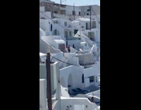 Two men shirtless jumping jacks on the balcony