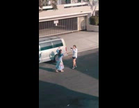 Girl blue dress sing loudly walk backwards