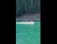Old lady drives jet ski in lake