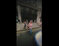 Collab IITW - Woman in black crop top poses in front of the sports car