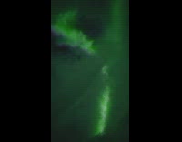 Northern green lights in the sky clouds moving around 
