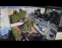 Security camera car crashes into parked cars 