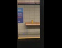 Yellow sock monkey left at subway station