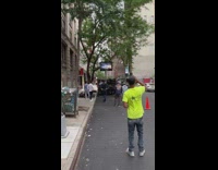 Person shoots bball at LED backboard hoop on truck