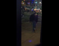 Old man wears jacket dance on sidewalk