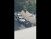 Girl white top jeans sit ground car