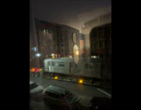 Woman films train cars being moved on street at night