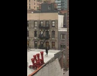 Girl dances rooftop neighbors watch from windows