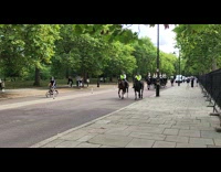 Guards ride on horse accompanied by police