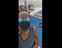 Woman in yellow bikini lie down on the yacht