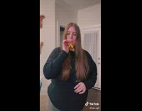 Girl inhales party horn and blows out sound