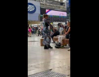 Collab IITW - Woman blue dress poses at train station