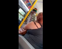 Man in rasta beanie sings while standing in subway train