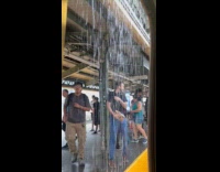 Rain water pour down near train doors