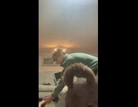 Guy lifts carries girl spins around dog