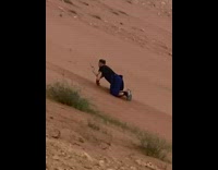 Man dig film falling sand slope mountain
