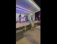 Old man dances in front of the stage 