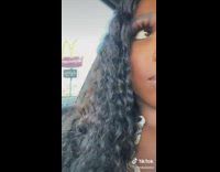 Little boy climbs into moms lap on car