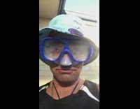 Man fill goggles with vape smoke hat