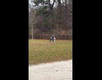 Men Spars Sumo with One Another on Grass