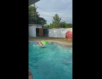 Girl green pool float falls backwards fail