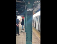 Person wearing shrimp mask and claws