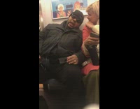 Man snores loudly on subway train, woman tries to tap shoulder and wake him up