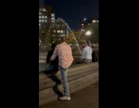 Man sits on fountain looks like peeing