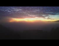 Drone fly over fog clouds sunset sky