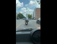 Collab winy - Two people on vespa scooter carry bookshelf