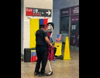 Man dance with skeleton woman at subway in NYC 