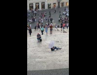 Woman white umbrella sit sideways on stairs 