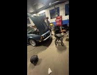 Guy sprays starting fluid on car top