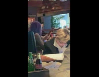 Purple hair girl live streams at restaurant 