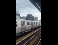 Man ride on top of train waves
