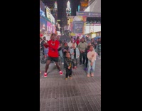 Crowd Dances to Music in Time Square