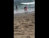 Guy white surfboard selfie orange shorts