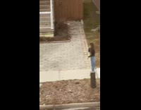 Two woman photo shoot outside house