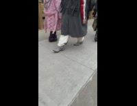 Person Walks Outside with Shoes Worn Inverted