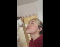 Cat slaps girl trying to kiss it