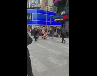 Five women time square puffy jacket dance