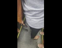 Guy on subway train has tall spiky pointy hair 