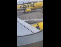 Flight worker puts tape and patches the engine of the plane