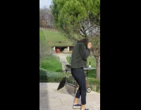 Lady shoots gun and gun flies backwards