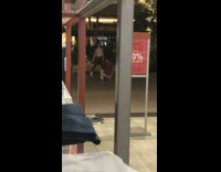 Woman in pink top tiktok dance at the mall