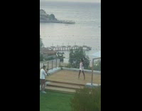 Woman white dress tiktok dance stage beach